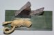 Mamut agyarból faragott mamut Csaroit ásványokkal