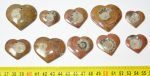 10 ammonite pendants polished to the shape of a heart